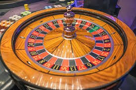 Live casino studio floor with multiple game tables